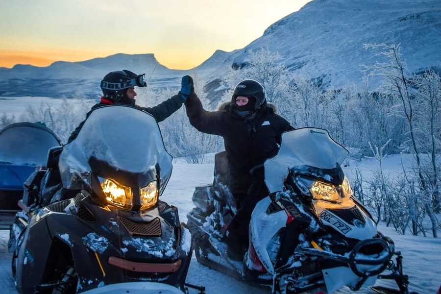 Abisko/Björkliden: Panorama Snowmobile Tour with Snacks - Climbing toward Čuonjávággi and Torneträsk