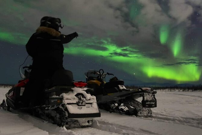 Enjoy the Aurora show on top of the mountain inc tipi dinner - Riding a snowmobile toward Mount Ednavaara