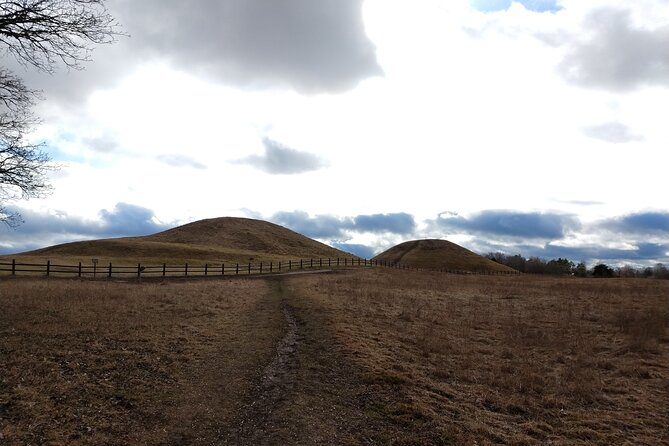 Guided tour 90min at Old Uppsala mounds and old Uppsala church - Reading the longhouse platforms near the church