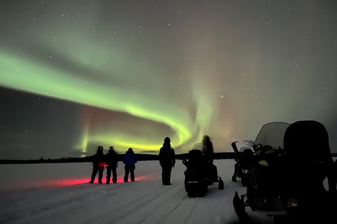 Northern Light snowmobile tour in Kiruna 7:30 pm - Passing Icehotel on the Torne River