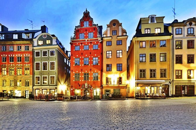 Painted merchant houses around Stortorget in the Stockholm old town at dusk
