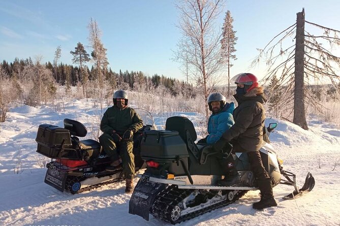 Private snowmobile day tours - Leaving Vuollerim for the Swedish winter forest