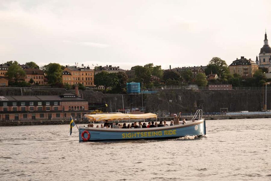 Stockholm: Guided City Sightseeing Open Electric Boat Tour - Östermalm and the shift toward Djurgården