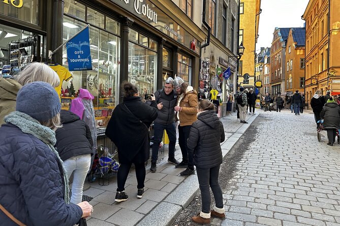 Stockholm Small Group Food Tour with 7 Classic Food Tastings - Tasting prawns, cheese, and Princess cake at Hötorget