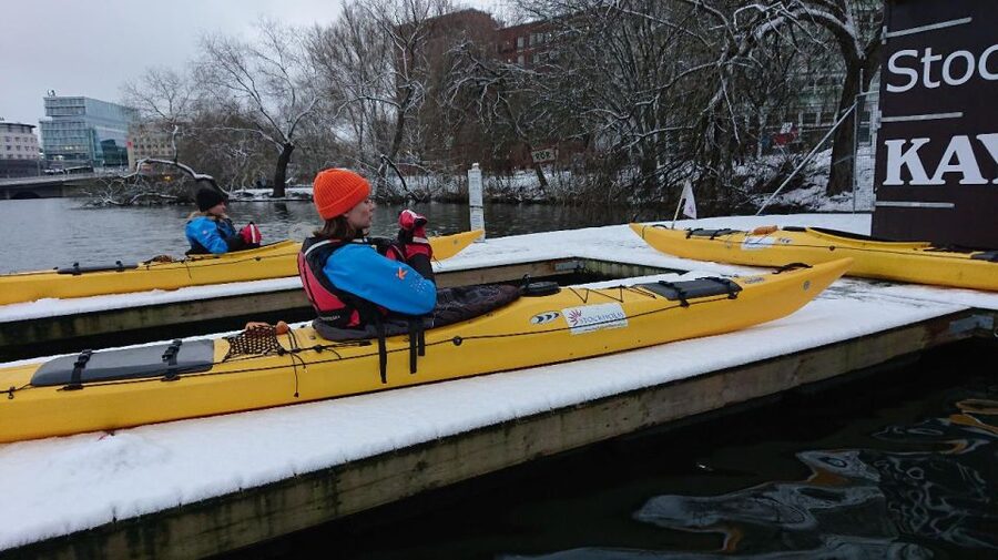 Stockholm: Winter City Kayaking Tour - Passing Stockholm City Hall from the water
